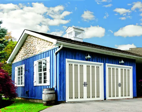 Carriage Court Arcadia garage door in Sandtone on a home