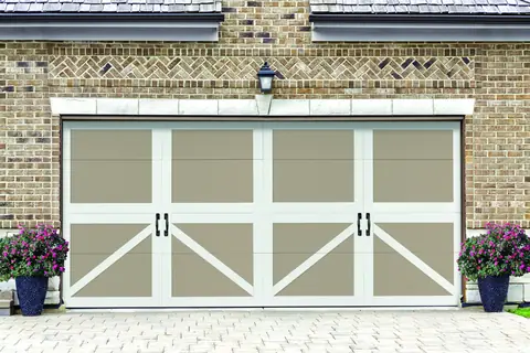 Carriage Court Newberry garage door in Sandtone on a home
