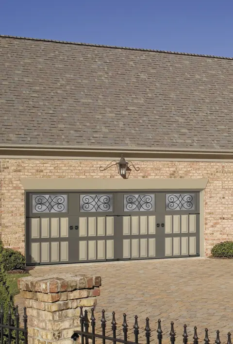 Classica Bordeaux garage door in Terratone / Wicker Tan on a home