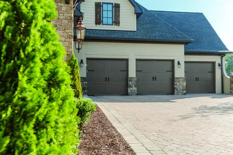 Classica Cortona garage door in Charcoal Gray on a home