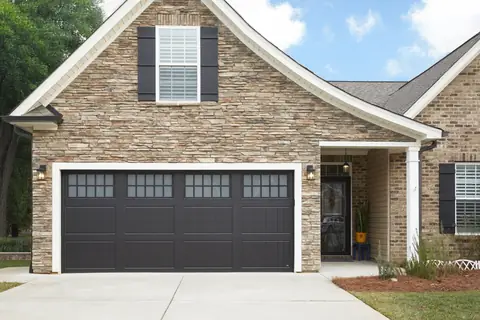 Classica Cortona garage door in Black on a home