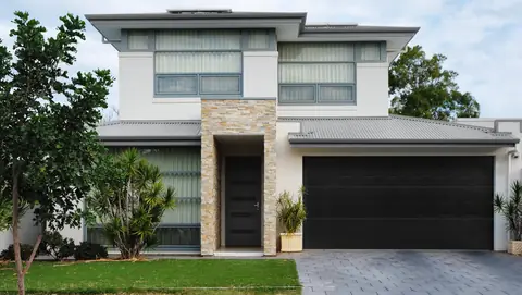 Classica Flush garage door in Black on a home