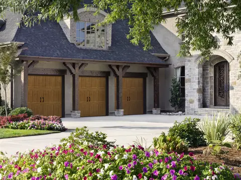 Classica Tuscany garage door in Golden Oak on a home