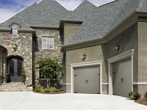 Classica Tuscany garage door in Sandtone on a home