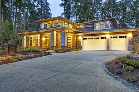 Designers Choice Long Bead Board garage door in True White on a home