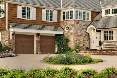 Designers Choice Recessed garage door in Walnut on a home