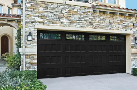 Designers Choice Recessed garage door in Black on a home