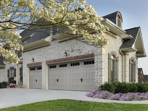 Designers Choice Recessed garage door in Sandtone on a home