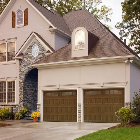 Designers Choice Recessed garage door in Walnut on a home