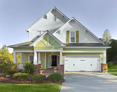 Heritage Bead Board garage door in True White on a home