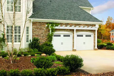 Heritage Bead Board garage door in True White on a home