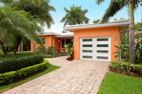 Heritage Ribbed garage door in True White on a home