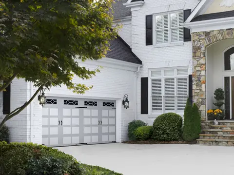 Hillcrest Bead Board garage door in Custom Paint Gray on a home