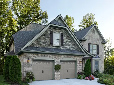 Hillcrest Bead Board garage door in Sandtone on a home