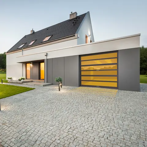 Horizon MultiView garage door in Dark Bronze Anodize on a home