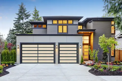 Horizon MultiView garage door in Charcoal Gray on a home