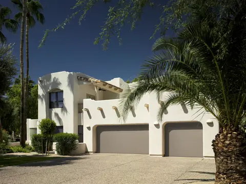 Lincoln Flush garage door in Sandtone on a home