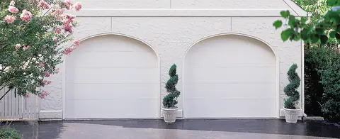 Lincoln Flush garage door in True White on a home