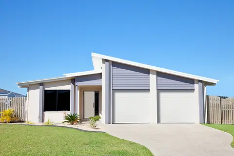 Lincoln Flush garage door in True White on a home