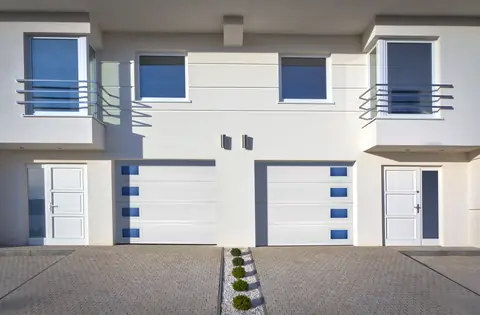 Lincoln Flush garage door in True White on a home