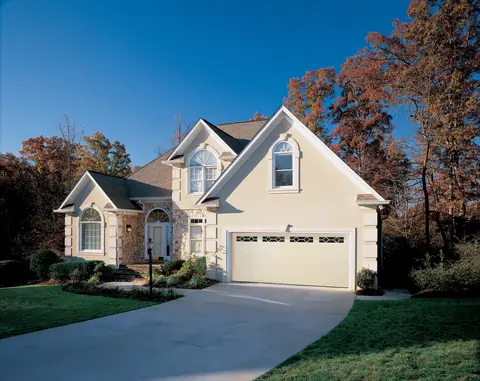 Lincoln Long garage door in Almond on a home