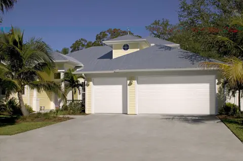 Lincoln Short garage door in True White on a home