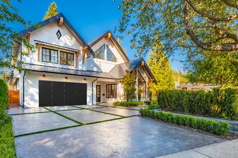 Olympus Long Recessed garage door in Black on a home