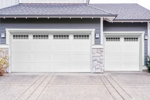 Olympus Long Recessed garage door in True White on a home