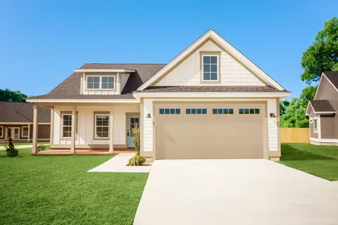 Olympus Long Recessed garage door in Wicker Tan on a home