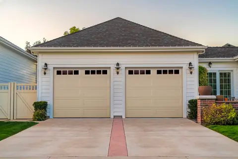 Olympus Long Recessed garage door in Wicker Tan on a home